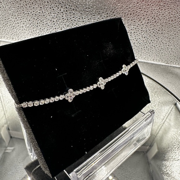 This bracelet is silver over brass with beautiful CZs and is adjustable. - Picture 7 of 8